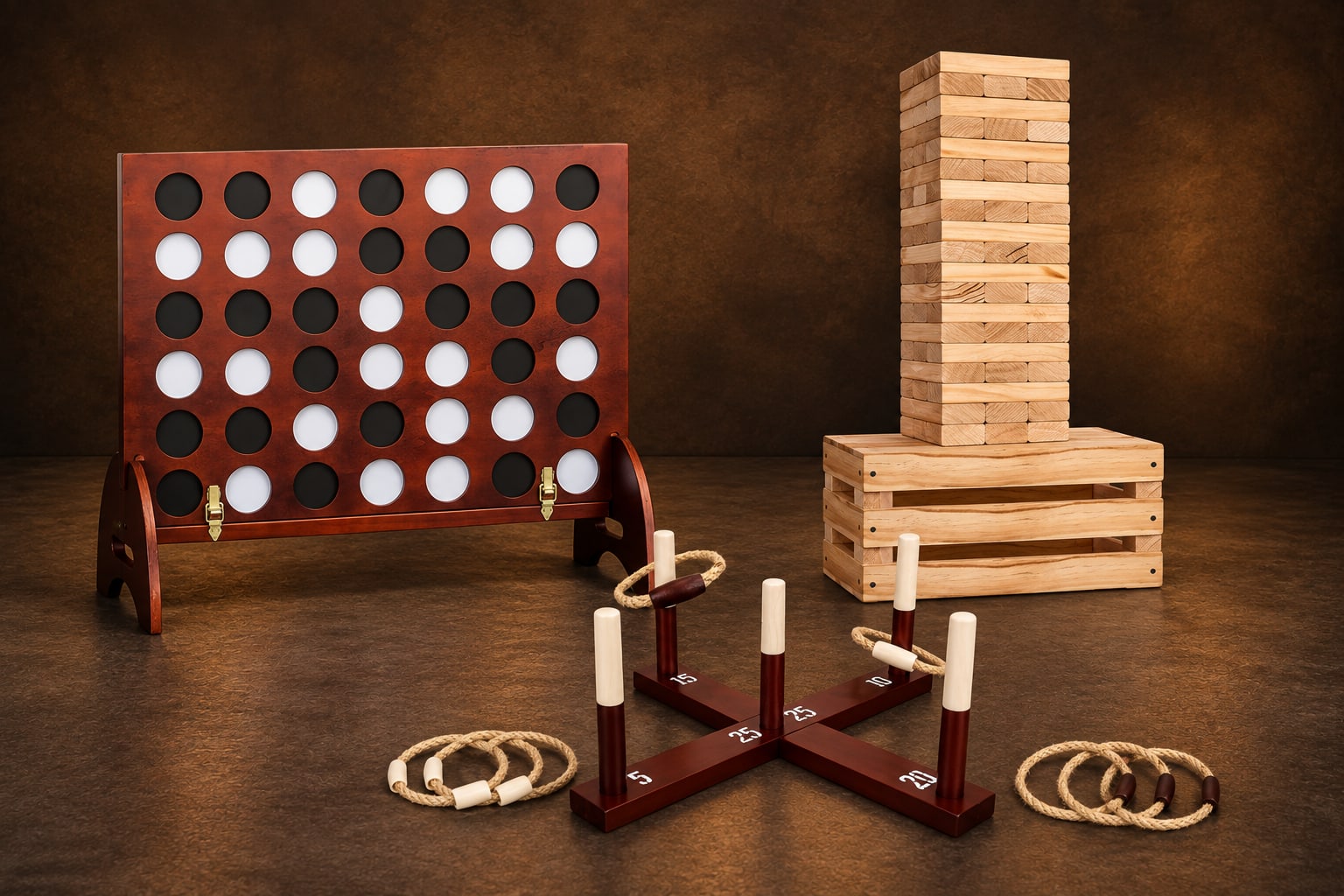Giant four-in-a-row, tumbling tower and ring toss on a warm chocolate studio background